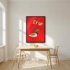Ey Up Duck – Postbox Red art print in a black frame, styled in a kitchen