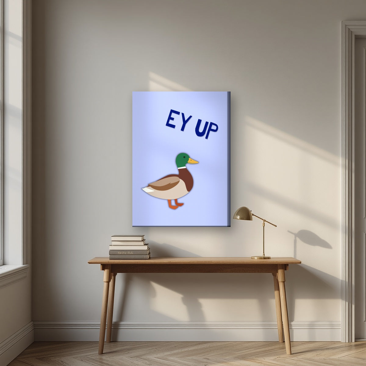 Ey Up Duck – Powder Blue art print on slim canvas, styled above a desk