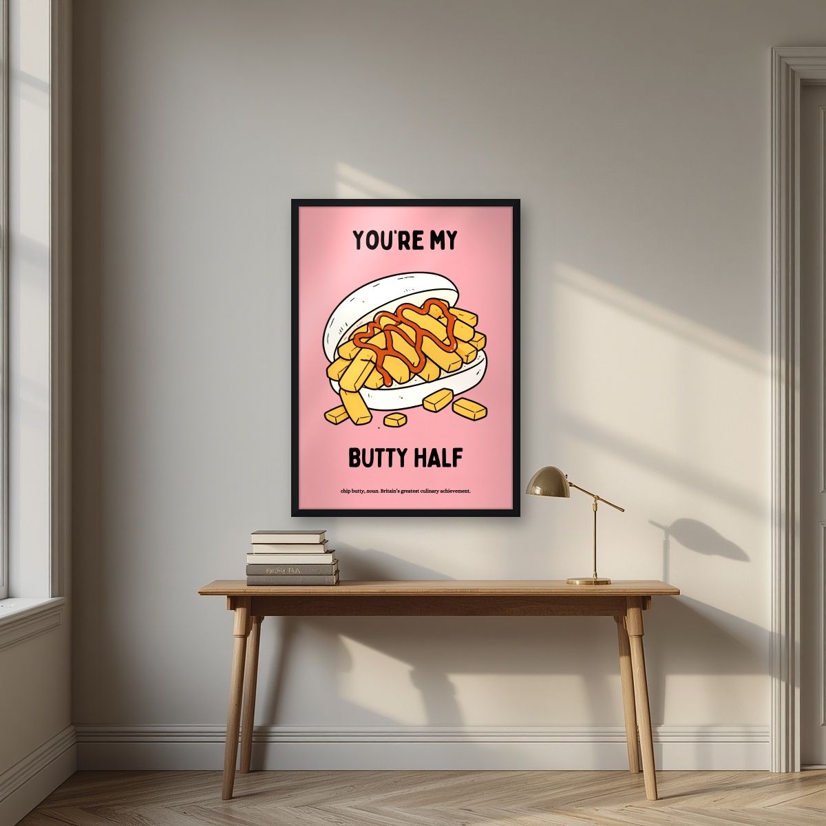 You're My Butty Half – Candyfloss Pink art print, in a black frame, styled in a desk