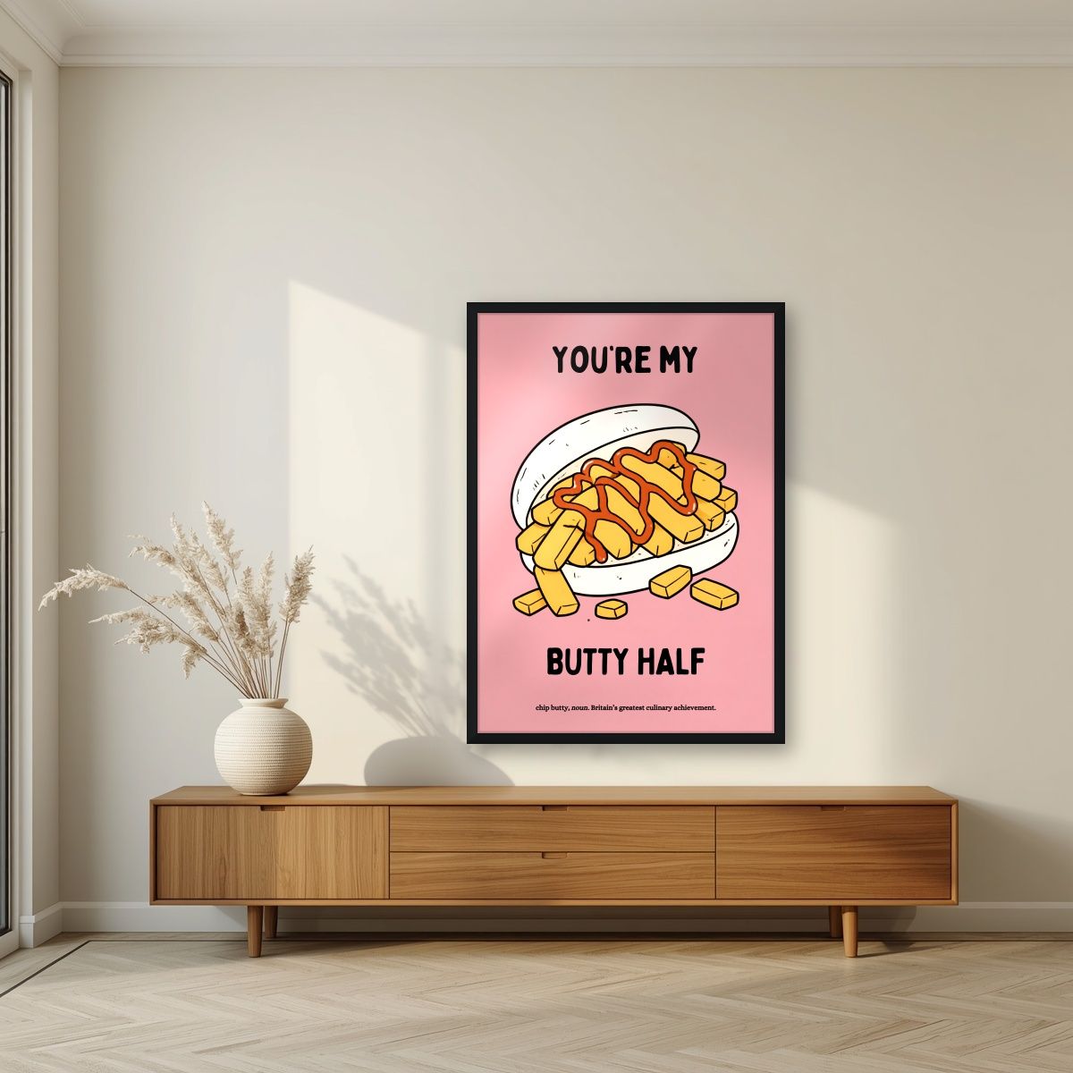 You're My Butty Half – Candyfloss Pink art print, in a black frame, styled in a living room
