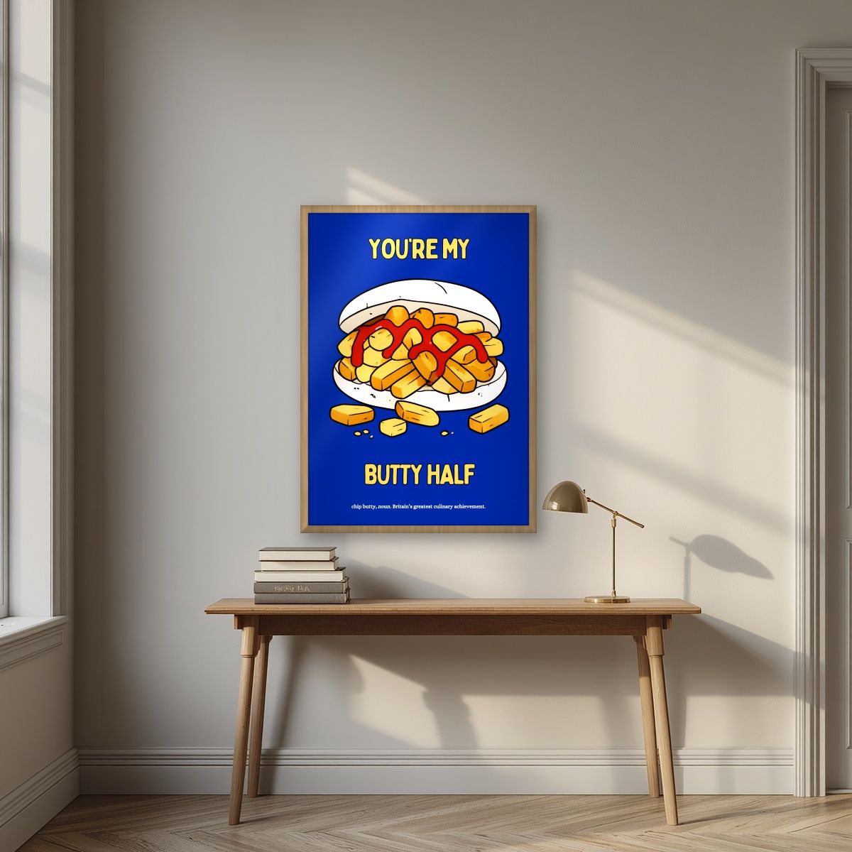 You're My Butty Half – Deckchair Blue art print, in an oak frame, styled in a desk