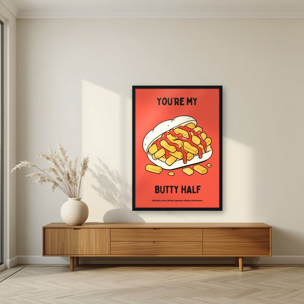 You're My Butty Half – Ketchup Coral art print, in a black frame, styled in a living room