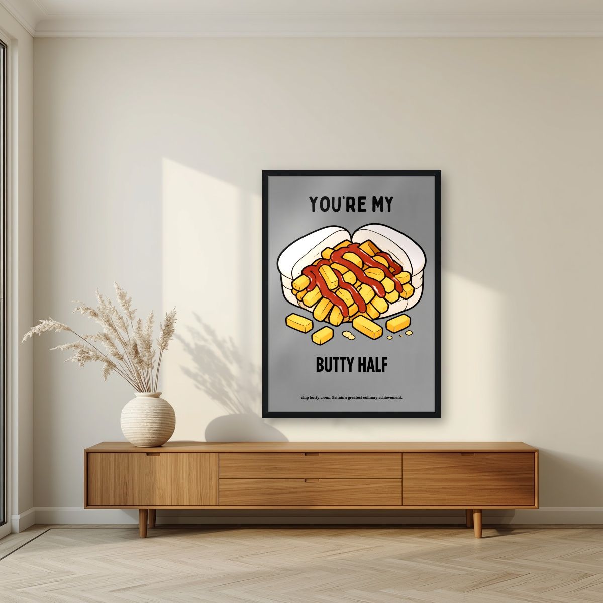 You're My Butty Half – Pebble Grey art print, in a black frame, styled in a living room