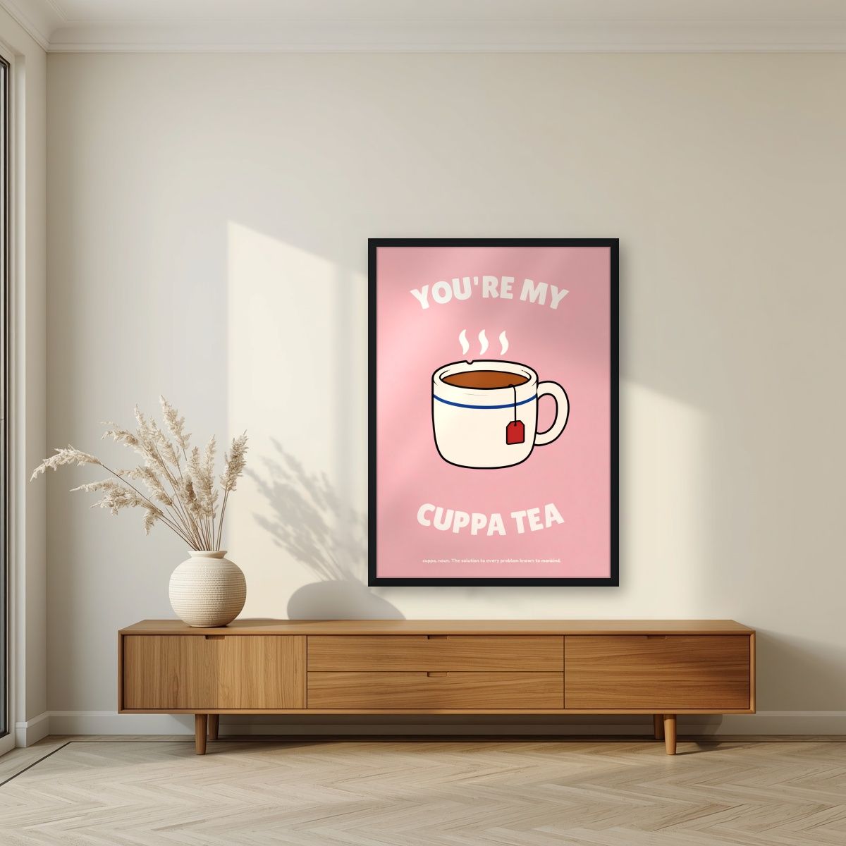 You're My Cuppa Tea – Battenberg Pink art print, in a black frame, styled in a living room