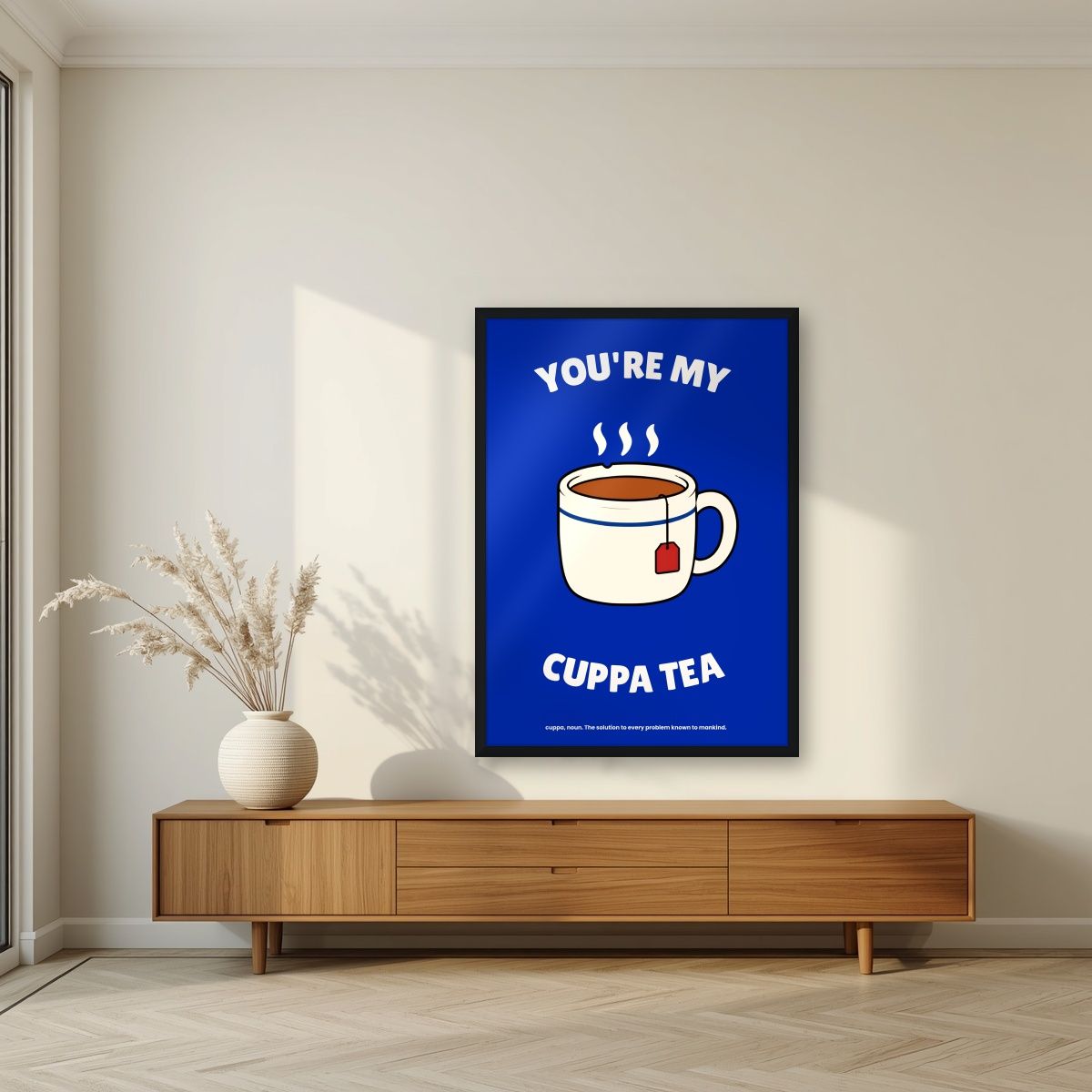 You're My Cuppa Tea – Midnight Navy art print, in a black frame, styled in a living room