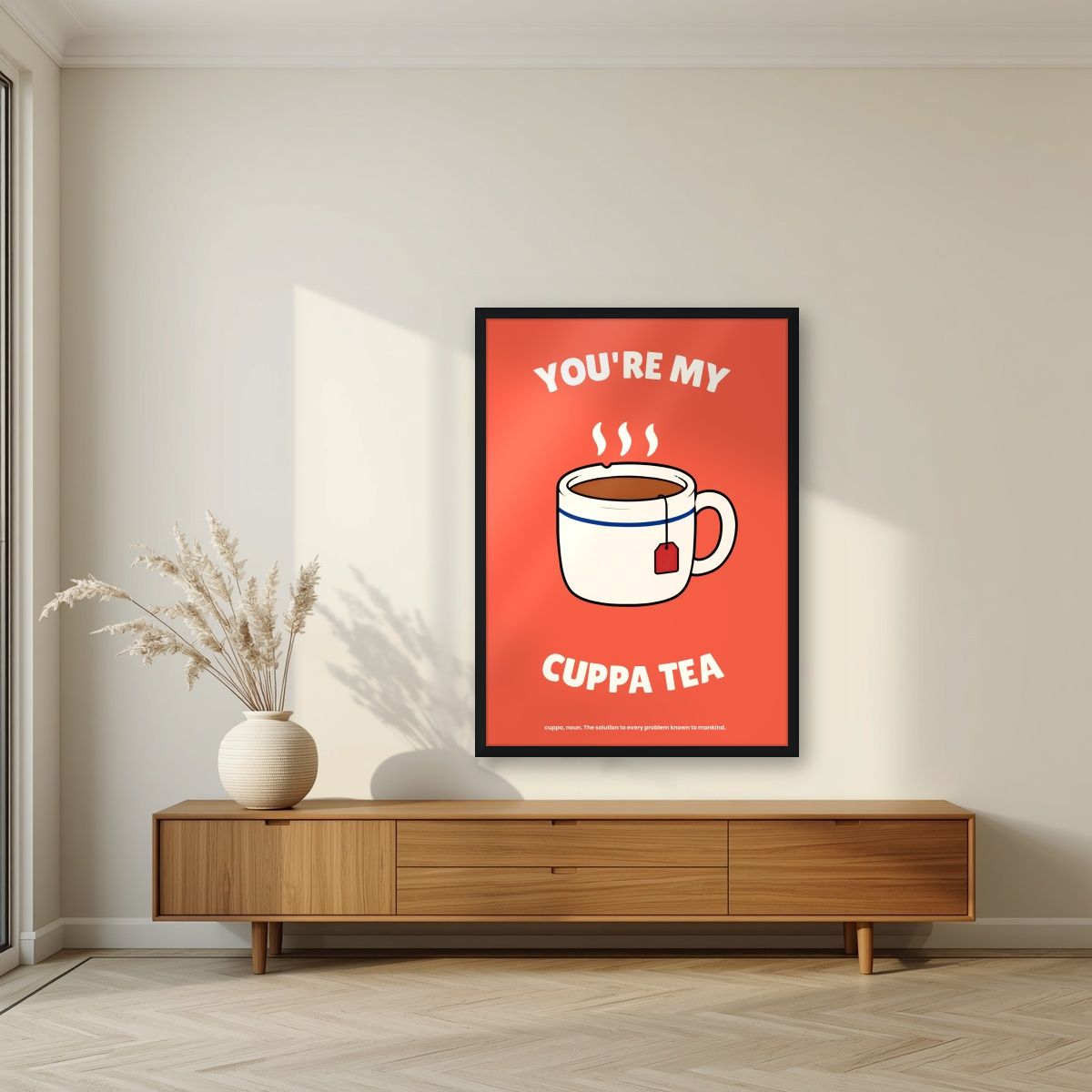 You're My Cuppa Tea – Postbox Coral art print, in a black frame, styled in a living room