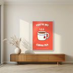 You're My Cuppa Tea – Postbox Coral art print, in a white frame, styled in a living room
