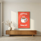 You're My Cuppa Tea – Postbox Coral art print, in an oak frame, styled in a living room