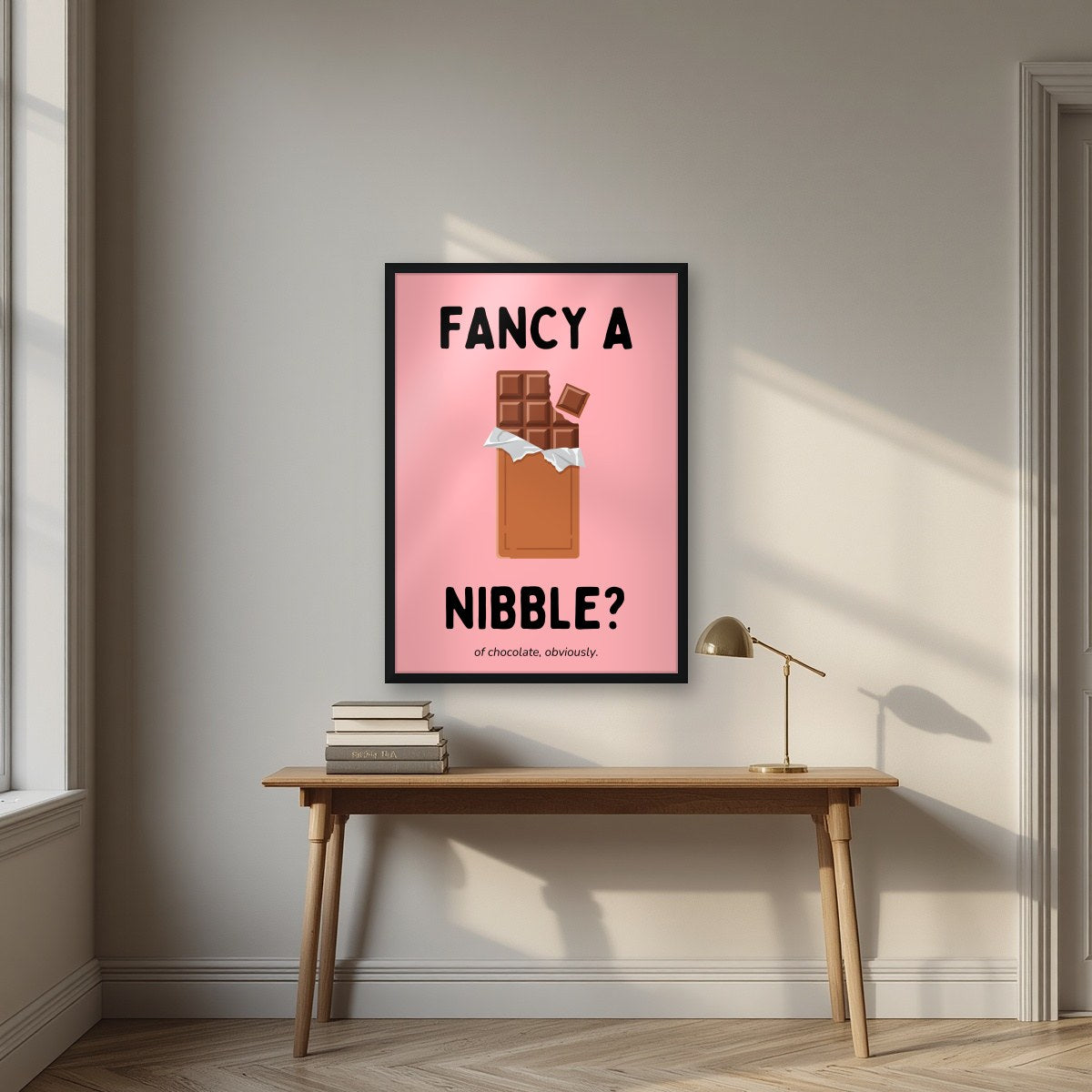 Fancy a Nibble – Candyfloss Pink art print, in a black frame, styled in a desk
