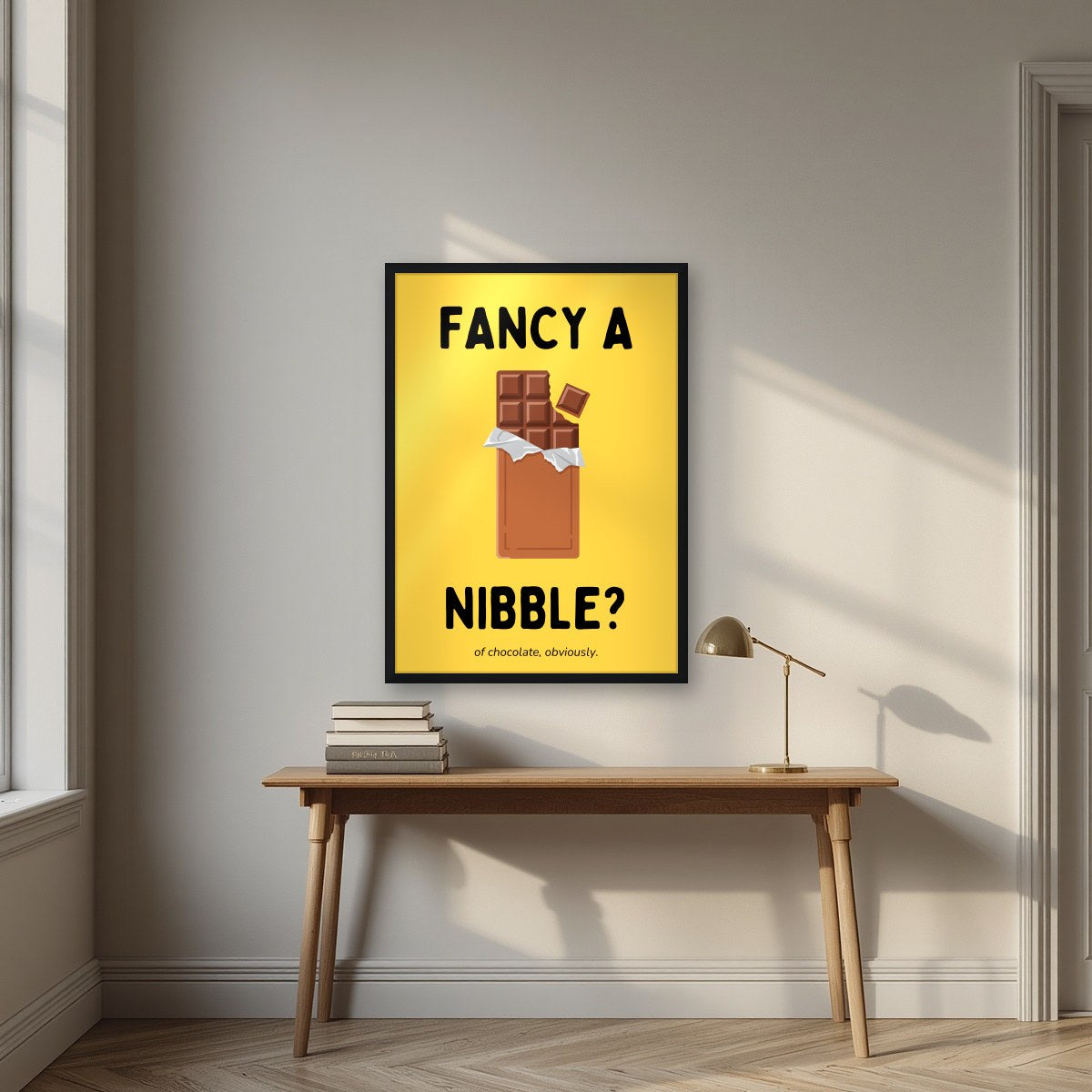 Fancy a Nibble – Chippy Gold art print, in a black frame, styled in a desk