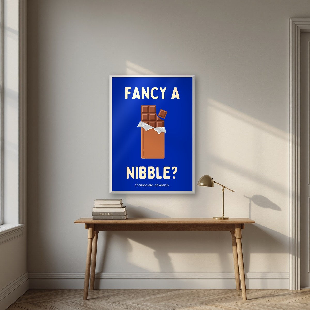 Fancy a Nibble – Deckchair Blue art print, in a white frame, styled in a desk
