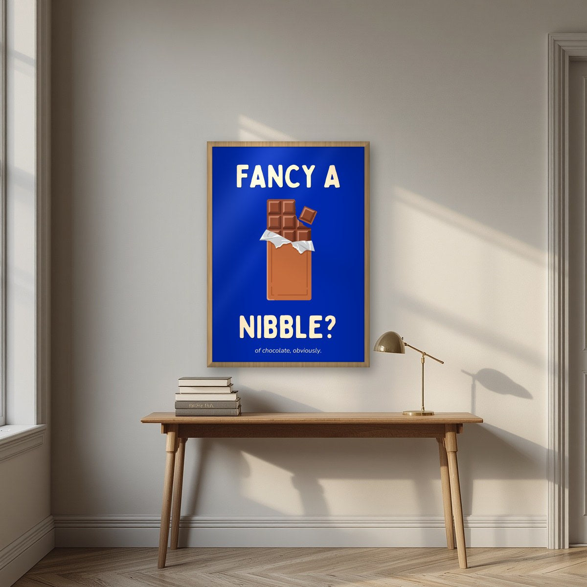 Fancy a Nibble – Deckchair Blue art print, in an oak frame, styled in a desk