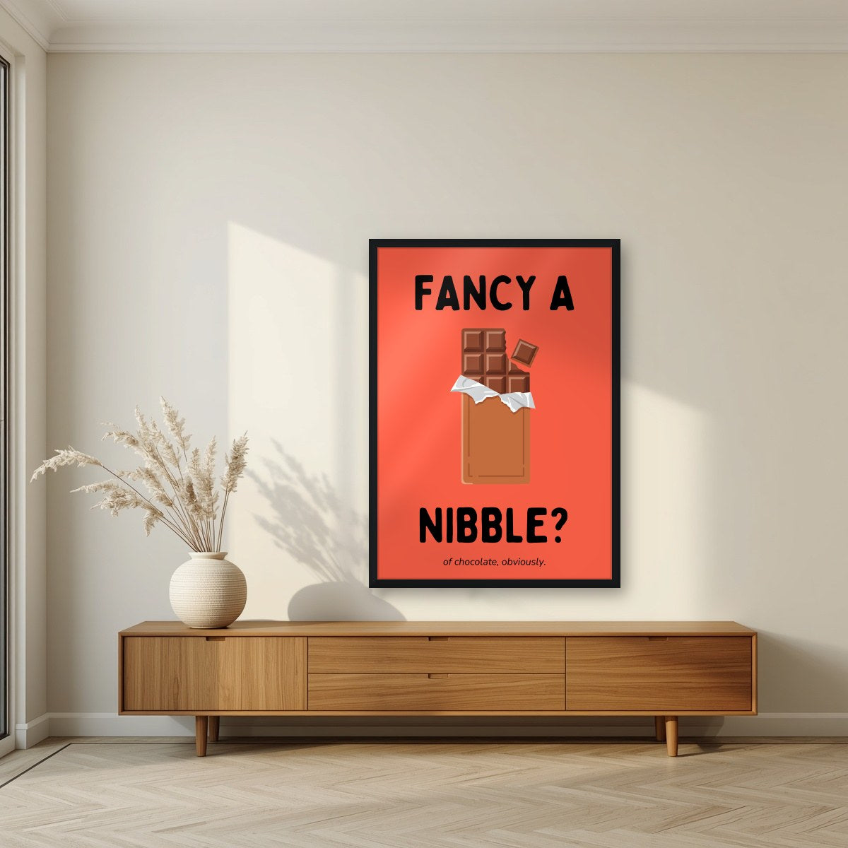 Fancy a Nibble – Ketchup Coral art print, in a black frame, styled in a living room