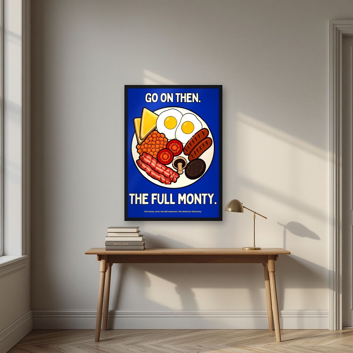 The Full Monty – Britannia Blue art print, in a black frame, styled in a desk