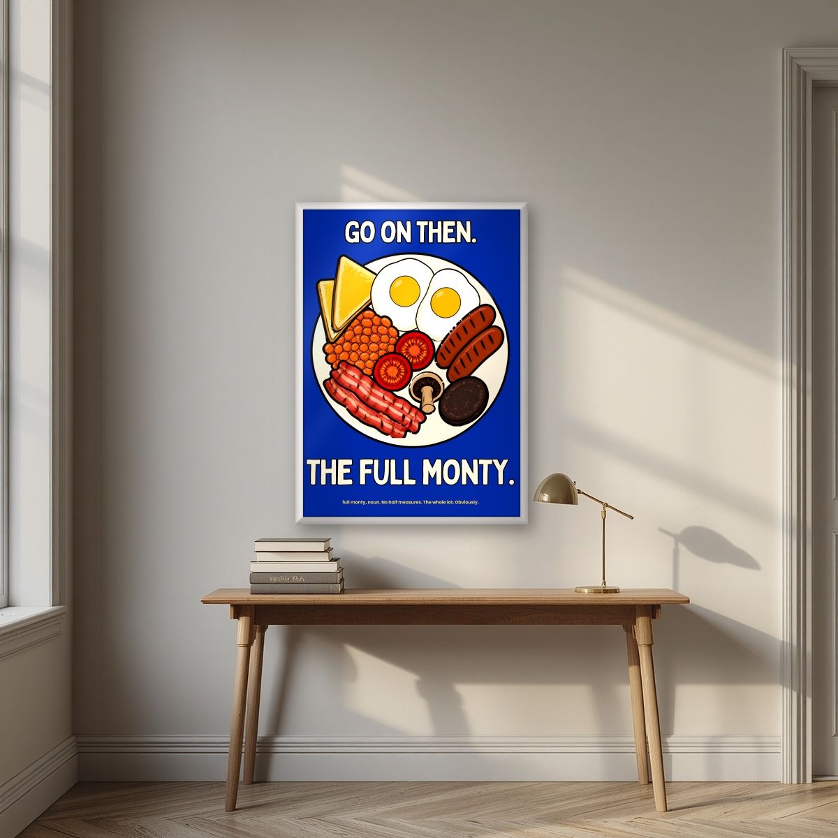 The Full Monty – Britannia Blue art print, in a white frame, styled in a desk