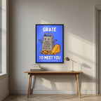 Grate to Meet You – Deckchair Blue art print, in a black frame, styled in a desk