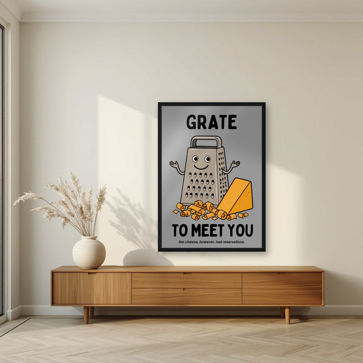 Grate to Meet You – Pebble Grey art print, in a black frame, styled in a living room