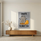 Grate to Meet You – Pebble Grey art print, in a white frame, styled in a living room