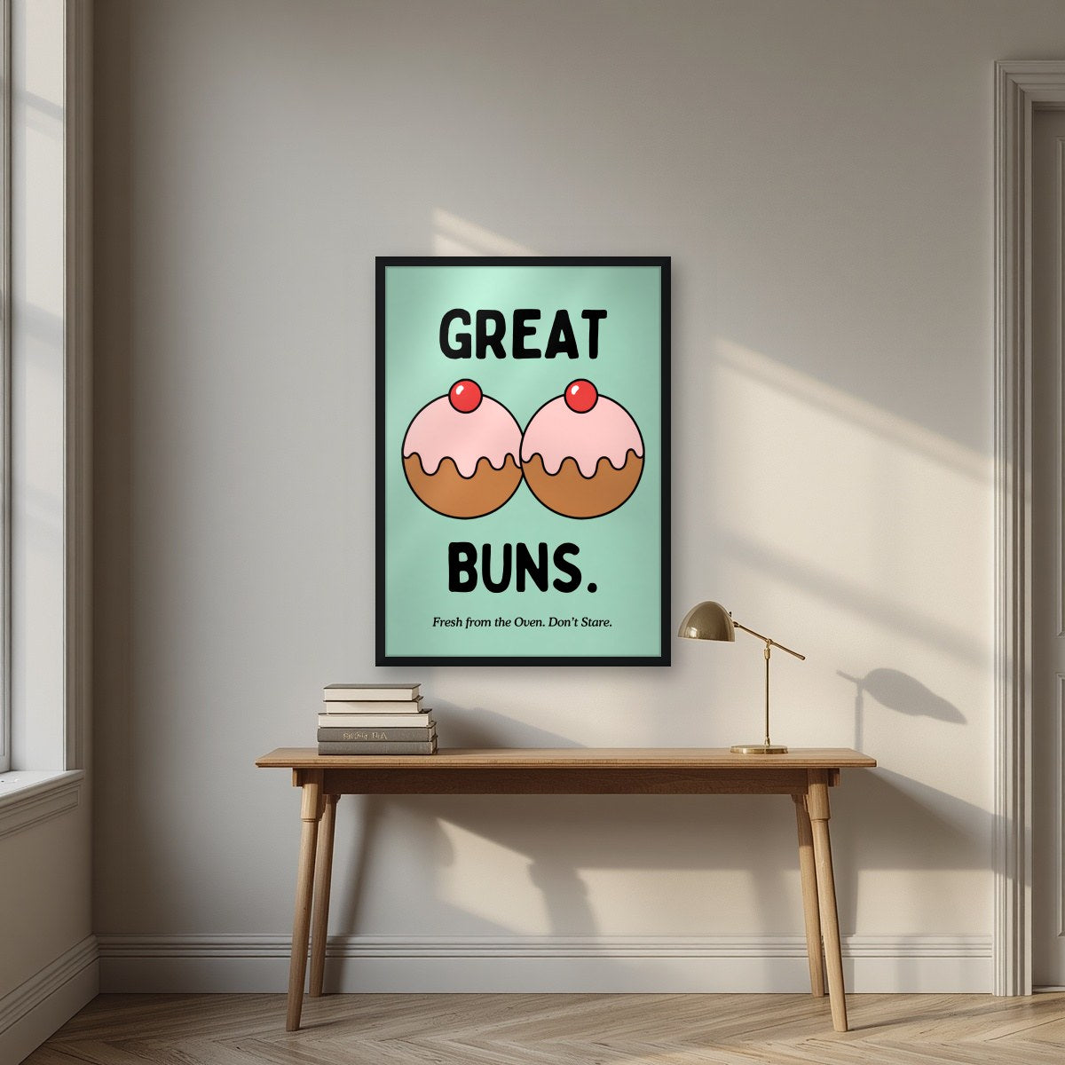 Great Buns – Mint Icing art print, in a black frame, styled in a desk