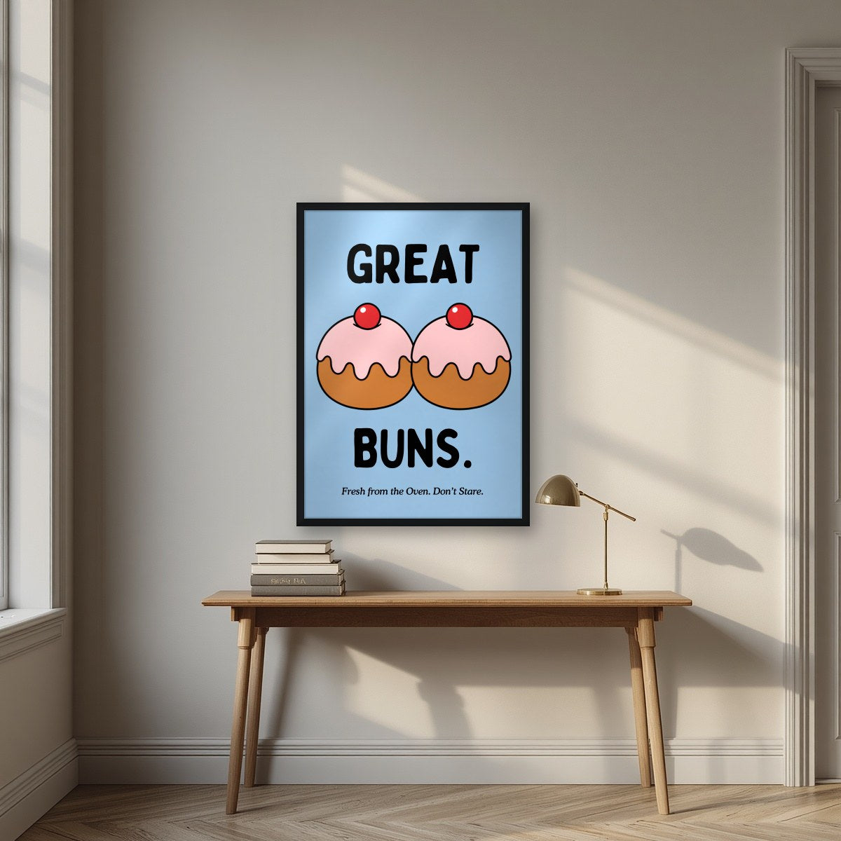 Great Buns – Powder Blue art print, in a black frame, styled in a desk
