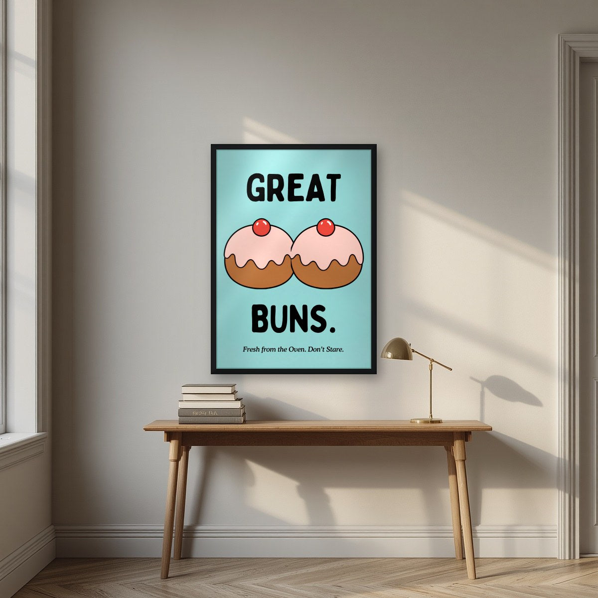 Great Buns – Seaside Teal art print, in a black frame, styled in a desk