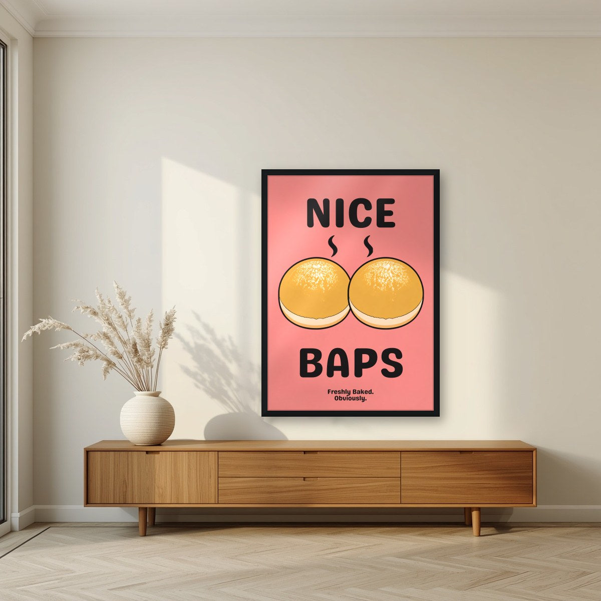 Nice Baps – Bakehouse Coral art print, in a black frame, styled in a living room