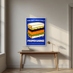 Now That's What I Call a Proper Sarnie – Deckchair Navy art print, in a white frame, styled in a desk