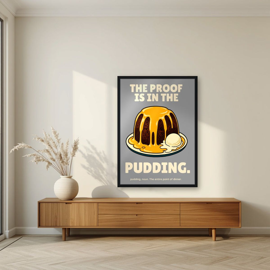 The Proof Is In The Pudding – Cobblestone Grey art print, in a black frame, styled in a living room