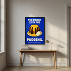 The Proof Is In The Pudding – Inkwell Blue art print, in a black frame, styled in a desk