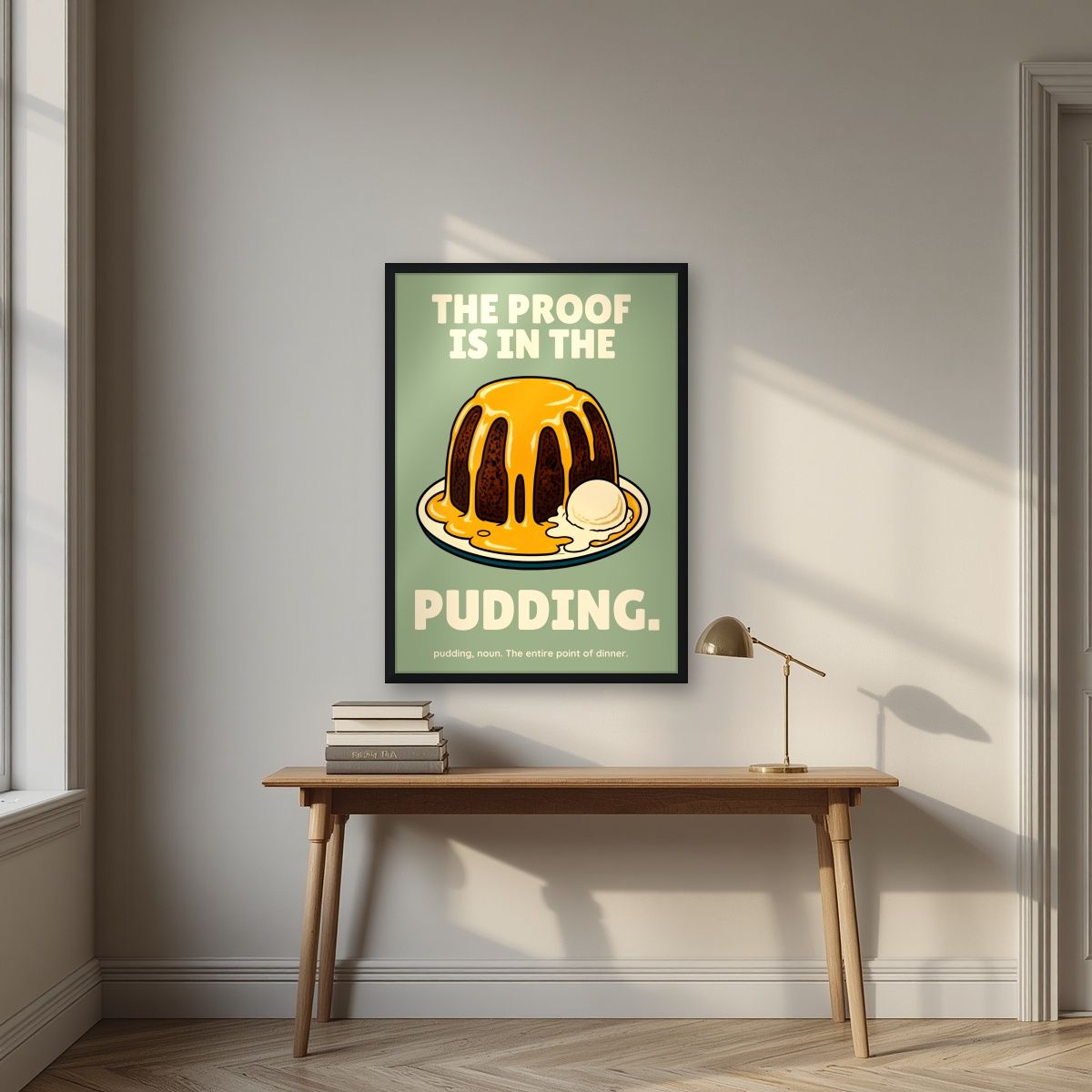 The Proof Is In The Pudding – Orchard Sage art print, in a black frame, styled in a desk