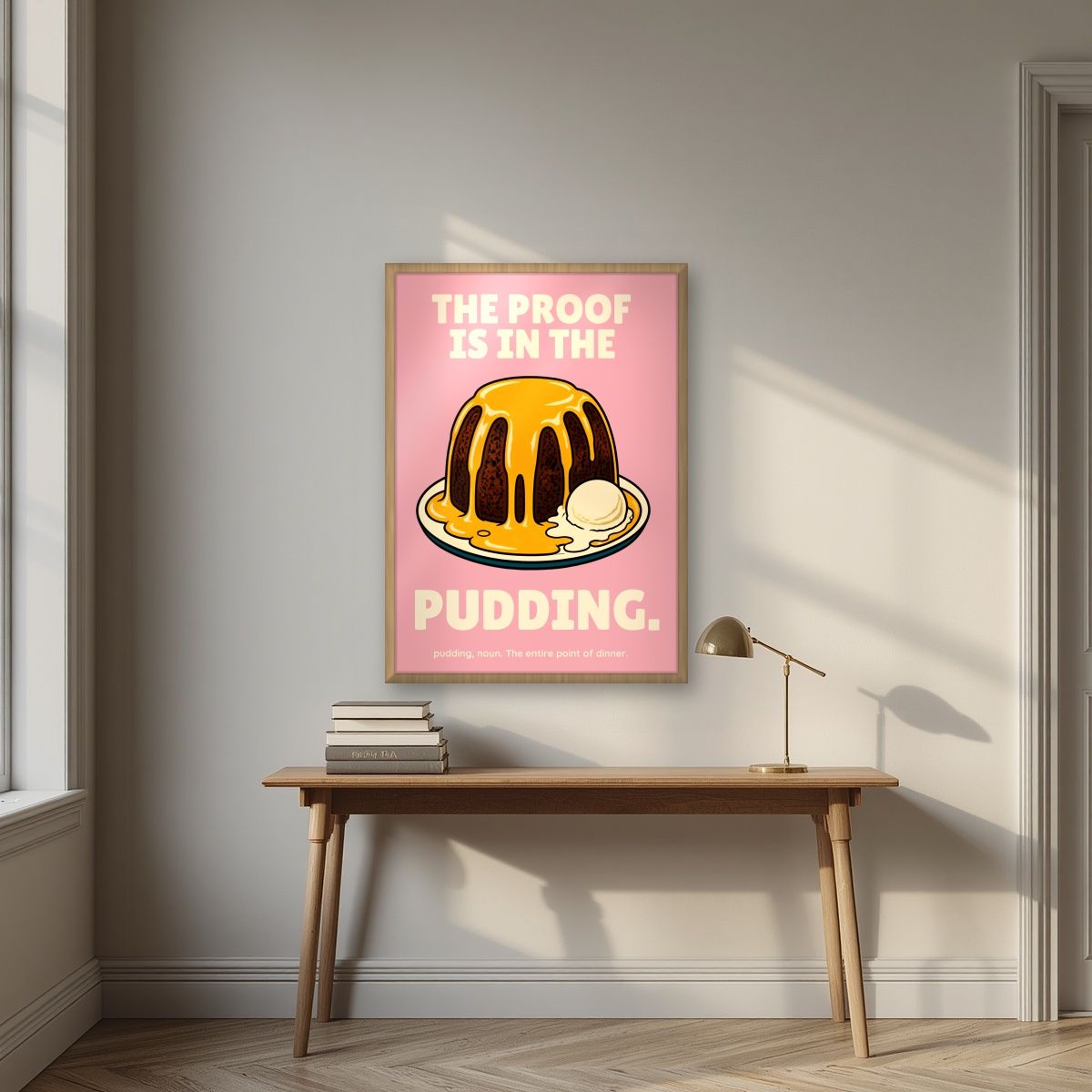 The Proof Is In The Pudding – Positano Pink art print, in an oak frame, styled in a desk