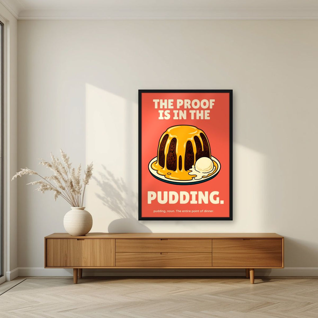 The Proof Is In The Pudding – Sunset Coral art print, in a black frame, styled in a living room