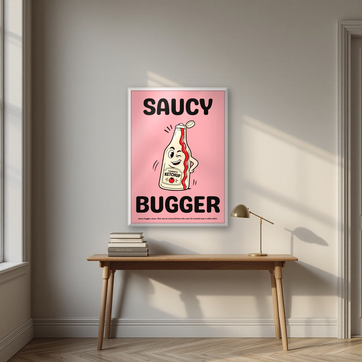 Saucy Bugger – Candyfloss Pink art print, in a white frame, styled in a desk