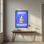 Saucy Bugger – Deckchair Blue art print, in a black frame, styled in a desk