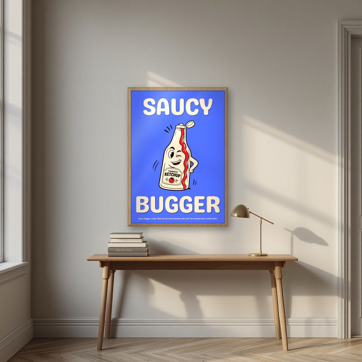 Saucy Bugger – Deckchair Blue art print, in an oak frame, styled in a desk