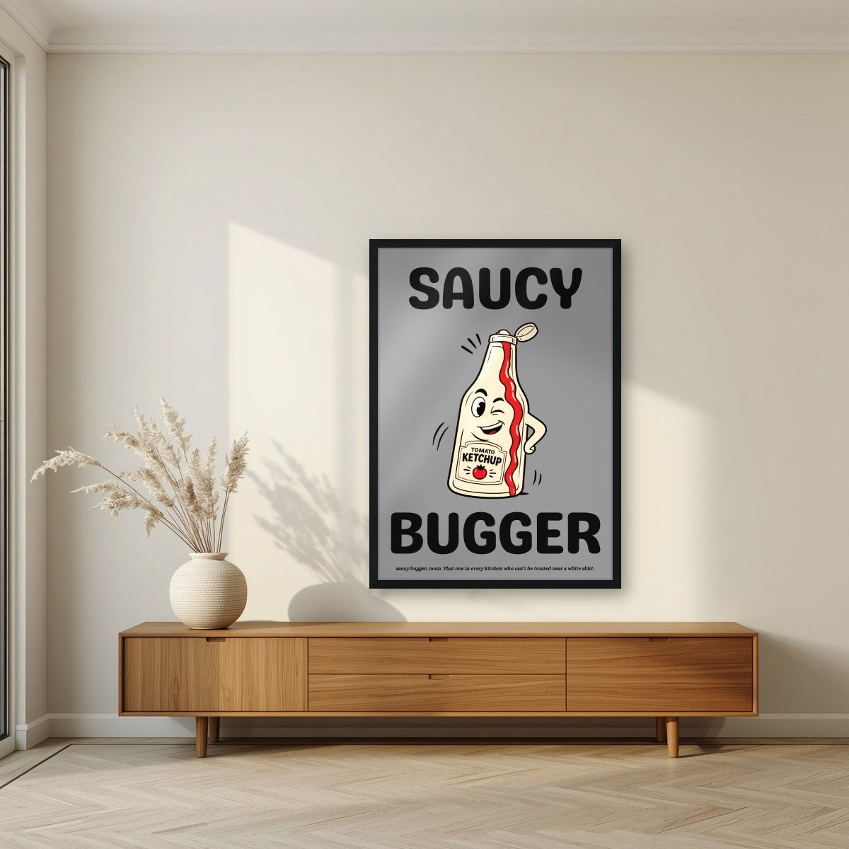 Saucy Bugger – Pebble Grey art print, in a black frame, styled in a living room