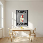 Saucy Bugger – Pebble Grey art print, in a black frame, styled in a kitchen