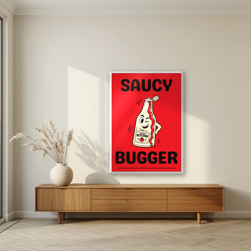 Saucy Bugger – Postbox Red art print, in a white frame, styled in a living room