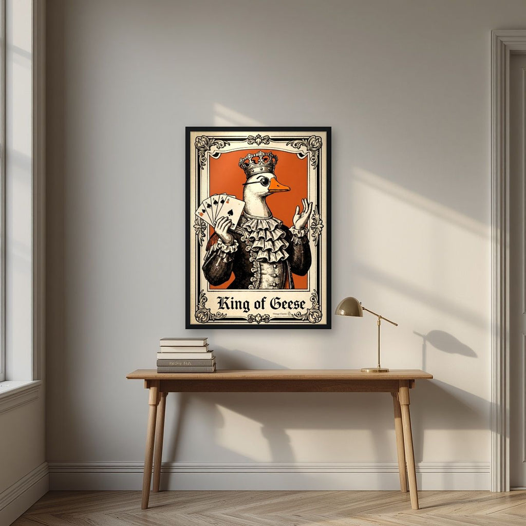 King of Geese – Burnt Amber art print, in a black frame, styled in a desk