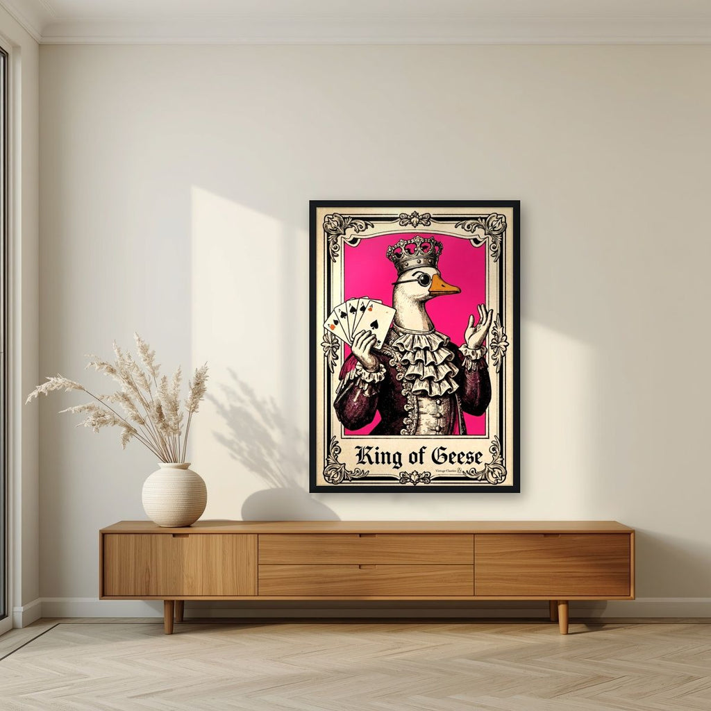 King of Geese – Jester Pink art print, in a black frame, styled in a living room