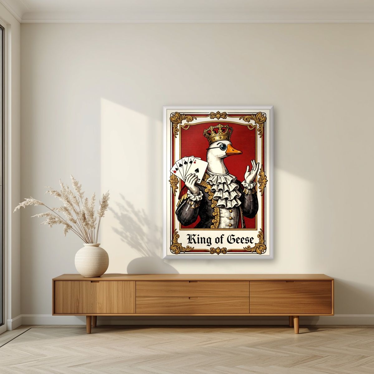 King of Geese – Regal Crimson art print, in a white frame, styled in a living room