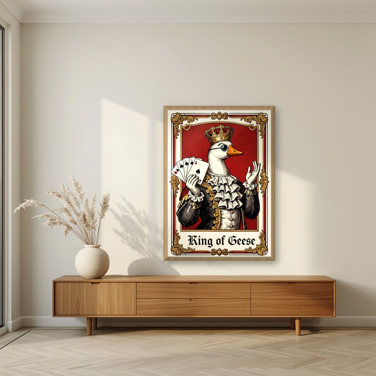 King of Geese – Regal Crimson art print, in an oak frame, styled in a living room