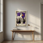 King of Geese – Sovereign Purple art print, in a white frame, styled in a desk
