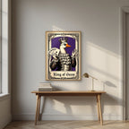 King of Geese – Sovereign Purple art print, in an oak frame, styled in a desk