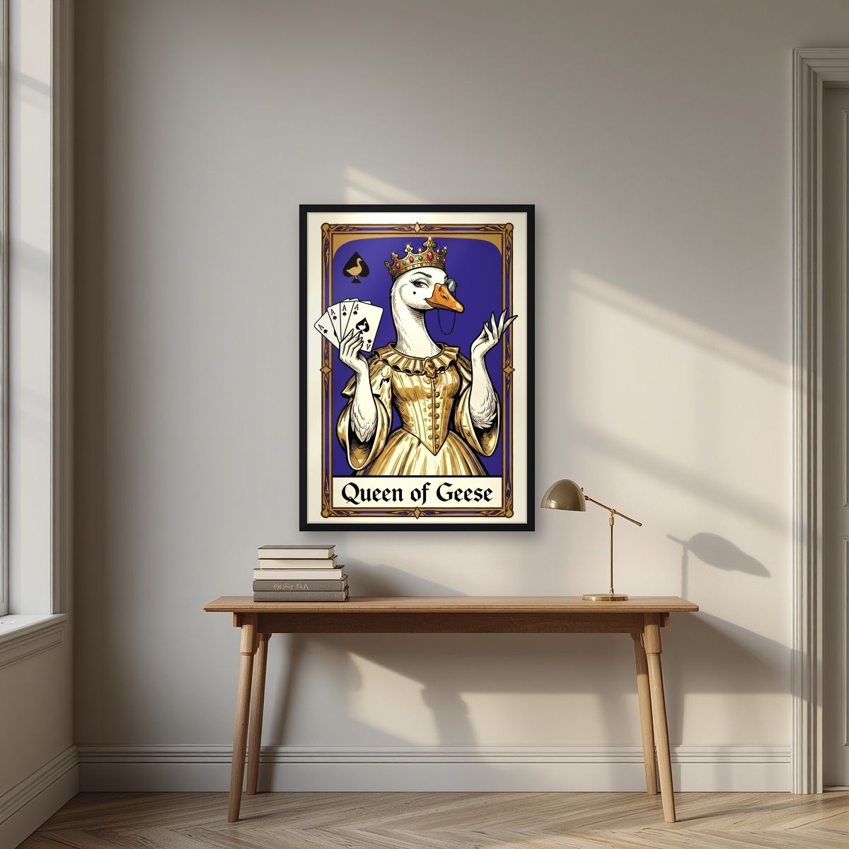 Queen of Geese – Cobalt Coronet art print, in a black frame, styled in a desk