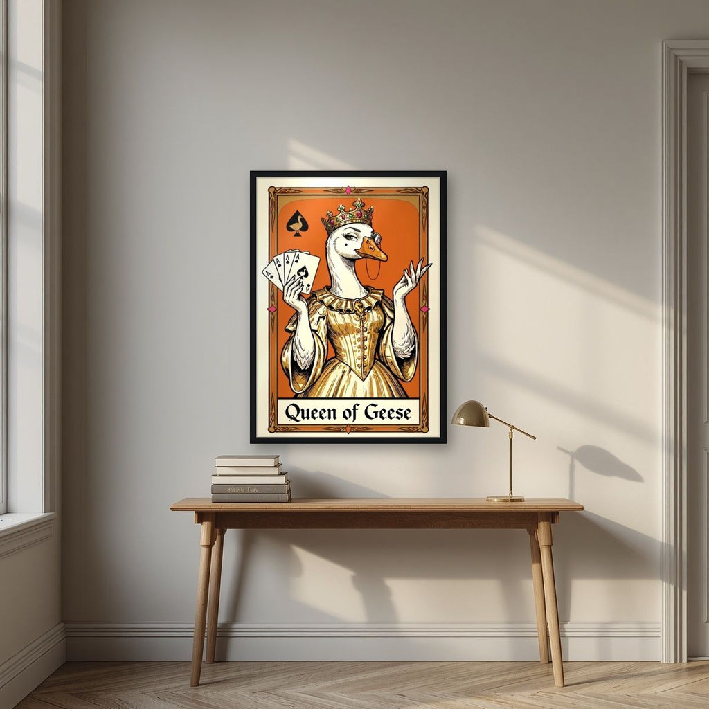 Queen of Geese – Tangerine Throne art print, in a black frame, styled in a desk