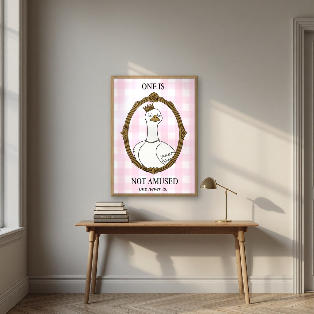 One Is Not Amused – Gingham Rose art print, in an oak frame, styled in a desk