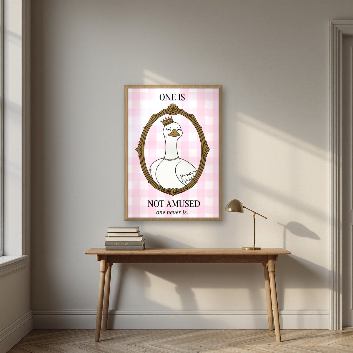 One Is Not Amused – Gingham Rose art print, in an oak frame, styled in a desk