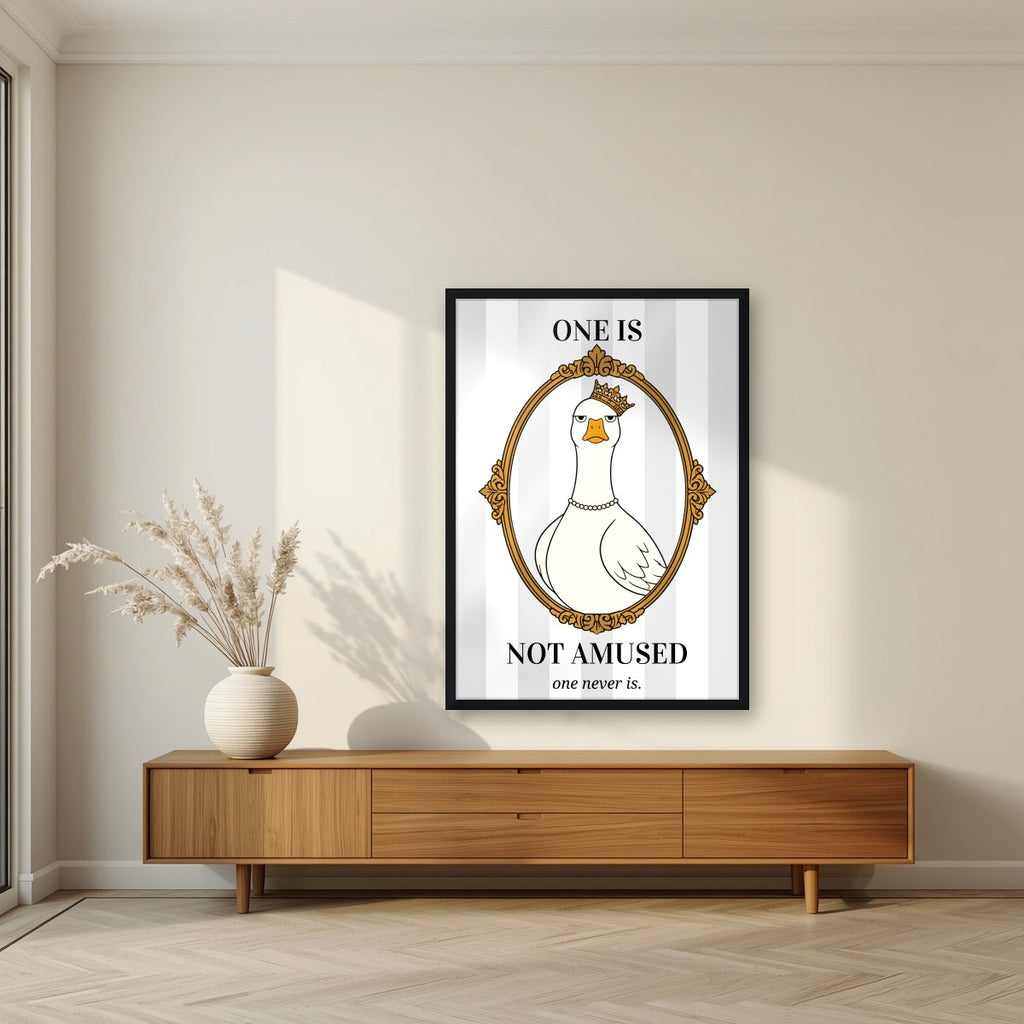 One Is Not Amused – Palace Grey art print, in a black frame, styled in a living room