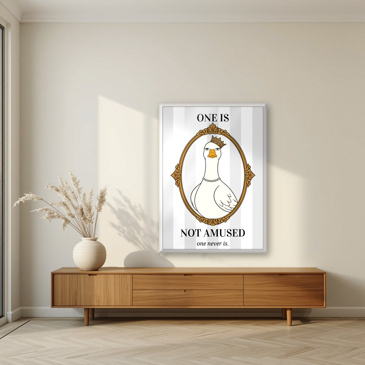 One Is Not Amused – Palace Grey art print, in a white frame, styled in a living room